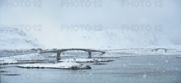 Fredvang bridges in heavy snowfall in winter. Lofoten islands