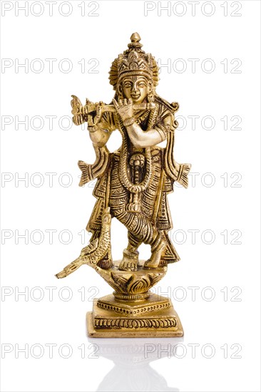 Krishna god Vishnu avatar brass statue isolated on white with reflection