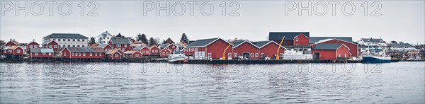 Panorama of Reine fishing village on Lofoten islands with red rorbu houses