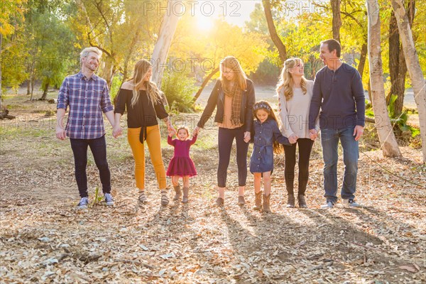 Multigenerational mixed-race family portrait outdoors