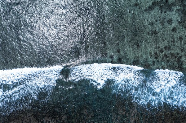 Aerial view of Flic en Flac beach with waves on the reefs