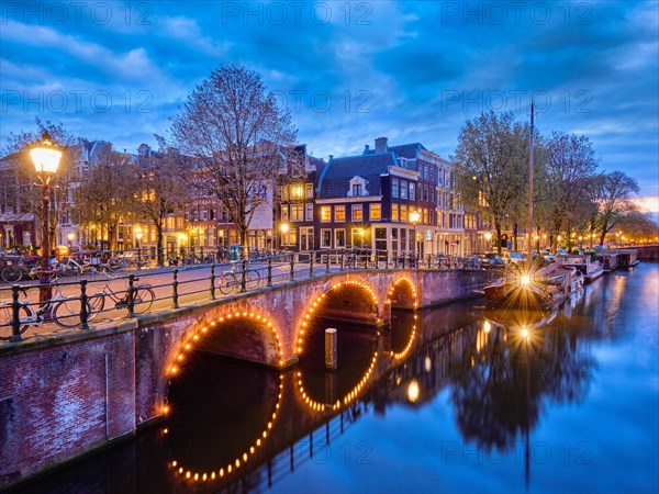 Night view of Amterdam cityscape with canal