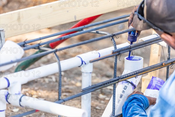 Plumber applying pipe cleaner