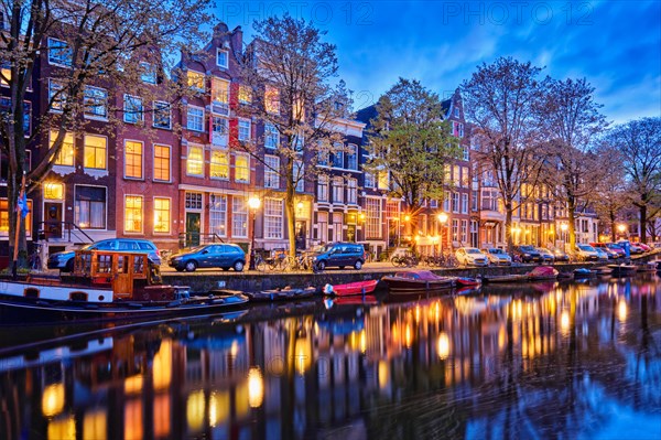 Night view of Amterdam cityscape with canal