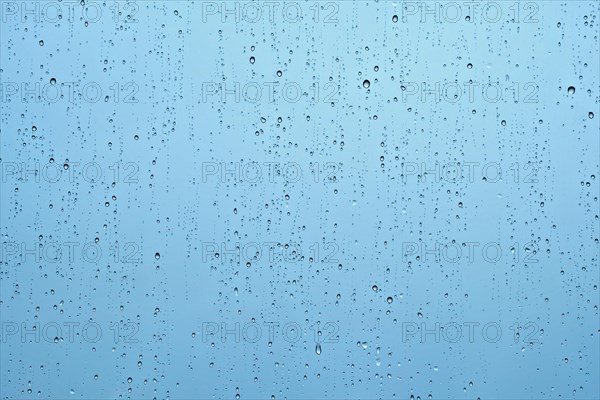 Rain water drops droplets on window glass texture background