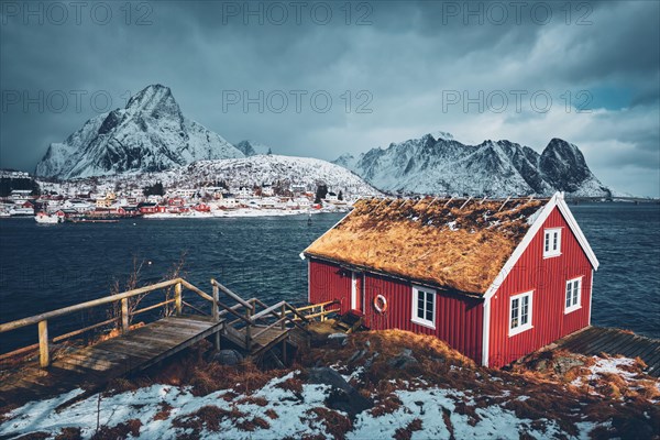 Traditional red rorbu house in Reine village on Lofoten Islands