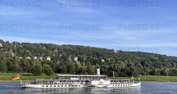 View over the Elbe with an old paddle steamer