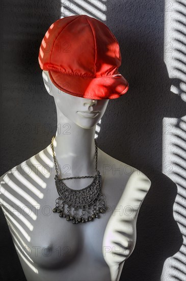 White fashion doll with red baseball cap and oriental silver jewellery