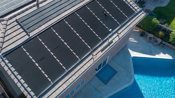 Thermal solar panels installed on the roof of a large house