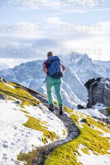 Young female hiker on hiking trail to Kramerspitz