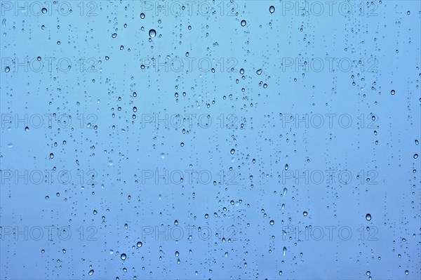 Rain water drops droplets on window glass texture background