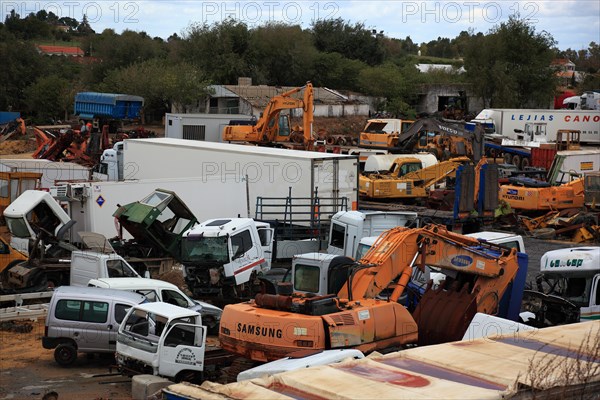 Car cemetery with truck