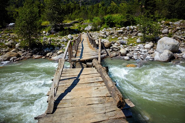 Bridge over Beas River in Himalayas near Manali. Kullu Valley