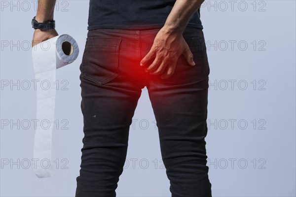 People with toilet paper in hand touching his buttock