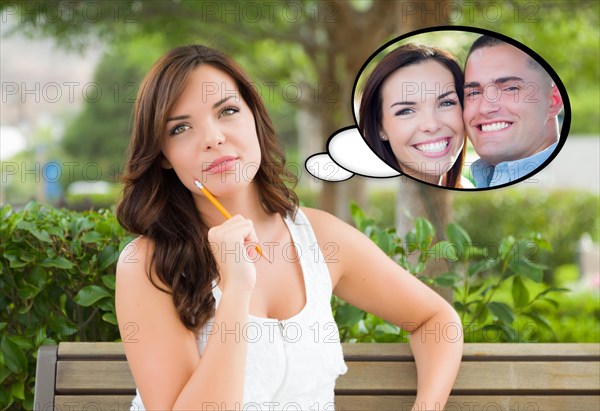 Thoughtful young woman with herself and handsome young man inside thought bubble