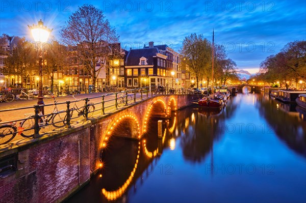 Night view of Amterdam cityscape with canal