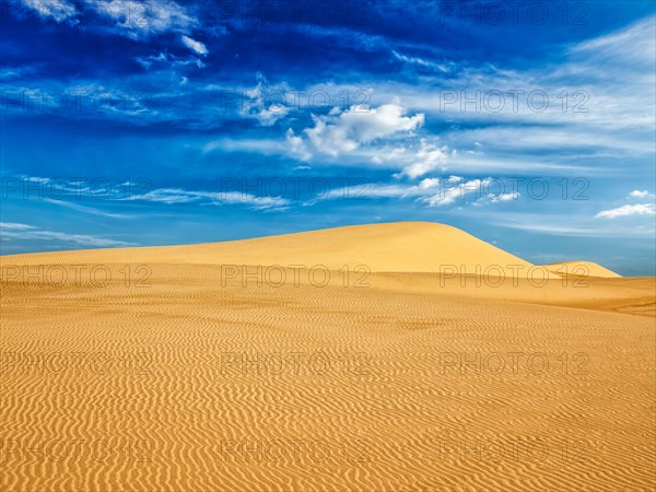 White sand dunes in desert on sunrise