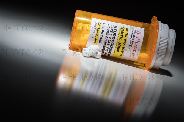 Hydrocodone pills and prescription bottle with non proprietary label. no model release required