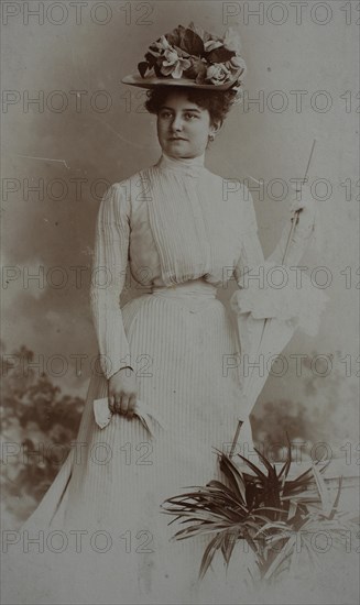 Distinguished lady with hat and parasol