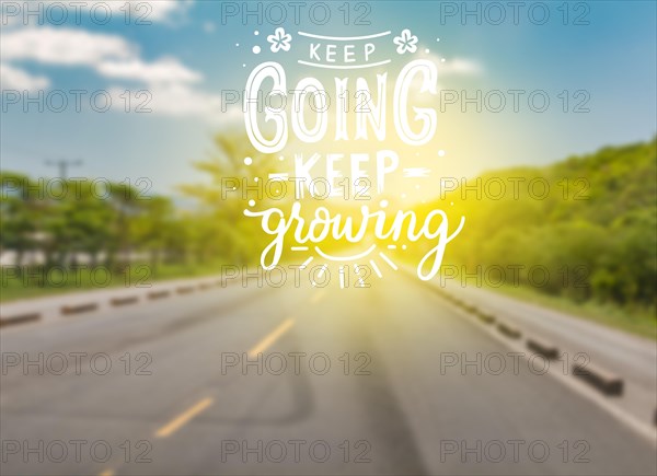 Asphalt road with motivational phrase