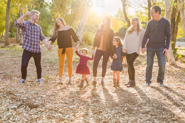 Multigenerational mixed-race family portrait outdoors