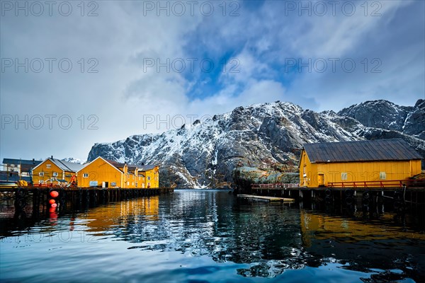 Nusfjord authentic fishing village in winter with red rorbu houses. Lofoten islands