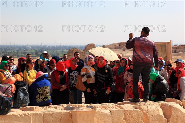 Tourist group with guide at the entrance to the mortuary temple of Hatshepsut