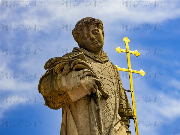 Sculpture of the patron saint Peter in front of the Einhard Basilica St. Marcellinus and Peter