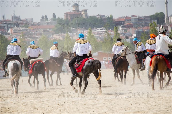 Horseman riding in their ethnic clothes on horseback