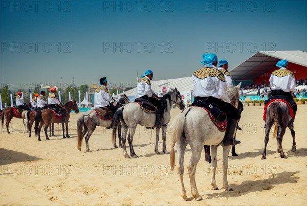 Horseman riding in their ethnic clothes on horseback