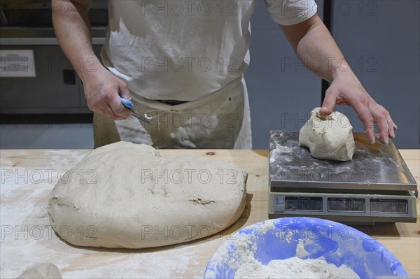 Baker Weighing dough
