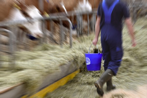 Wiping Picture Farmer with Ufa Plastic Bucket