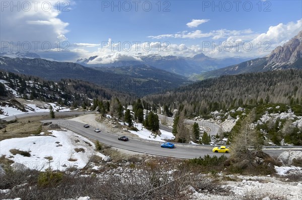 Sports car in switchbacks of mountain pass in Alps