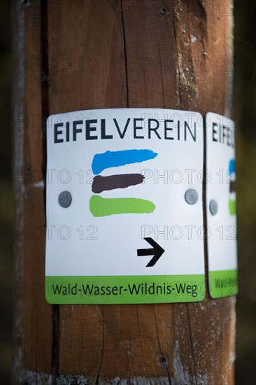 Sign for hikers on the edge of the Eifel National Park