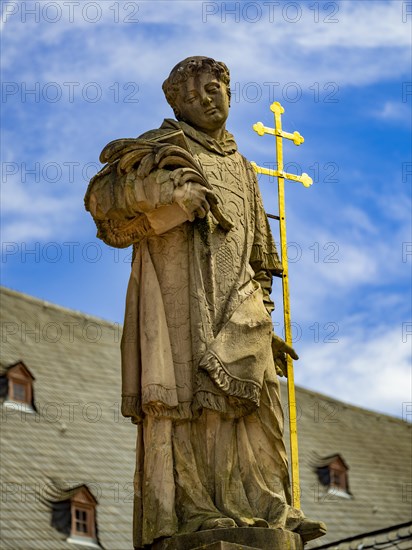 Sculpture of the patron saint Peter in front of the Einhard Basilica St. Marcellinus and Peter