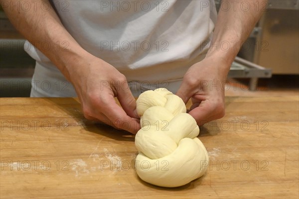 Bakers plaiting butter plait