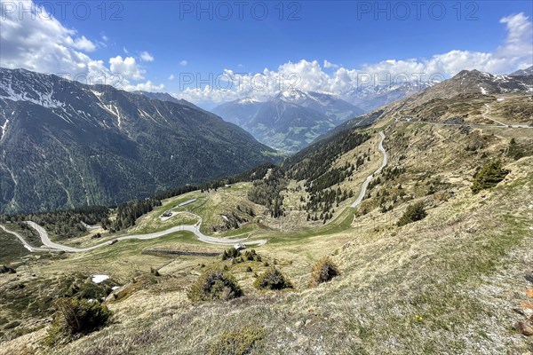 View from pass summit of mountain pass Jaufenpass to south ramp with southern ascent