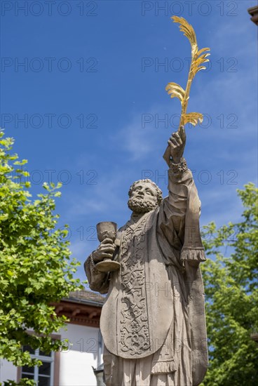 Sculpture of the patron saint Marcellinus in front of the Einhard Basilica of St. Marcellinus and Peter