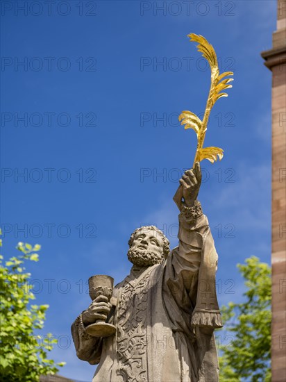 Sculpture of the patron saint Marcellinus in front of the Einhard Basilica of St. Marcellinus and Peter