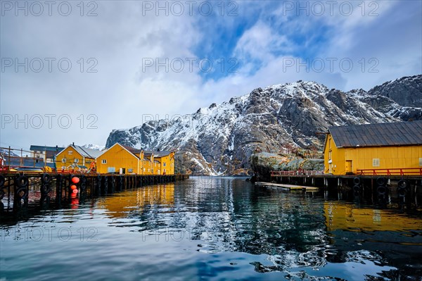 Nusfjord authentic fishing village in winter with red rorbu houses. Lofoten islands