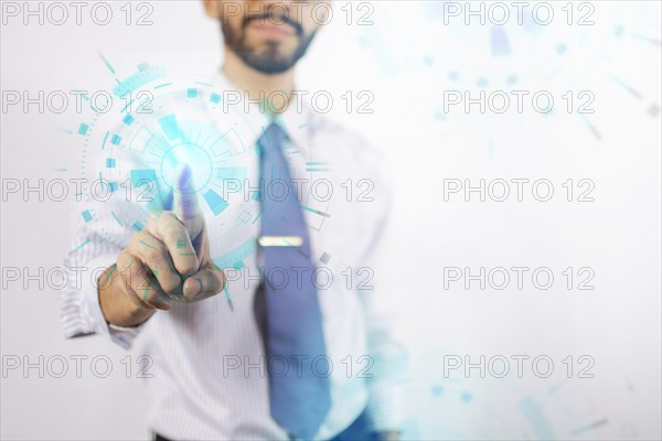 Businessman touching holographic icons