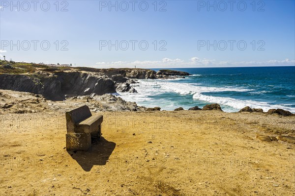 A bench with panoramic view on cliffs and beaches in Porto Covo