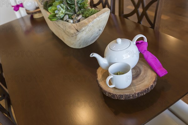 Beautiful abstract of inviting table setting with tea and kettle