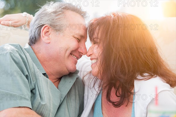 Happy middle aged couple enjoy A romantic moment together outside