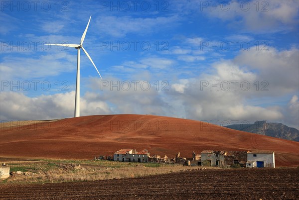 Windmill and abandoned houses in front of it