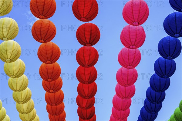 Colourful lanterns strung across the street