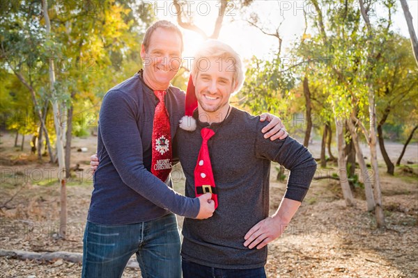 Handsome festive father and son portrait outdoors