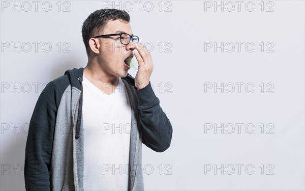Handsome man with bad breath and halitosis problem