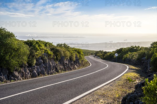 The scenic road through Natural Park of Arrabida with the view on Setubal Bay