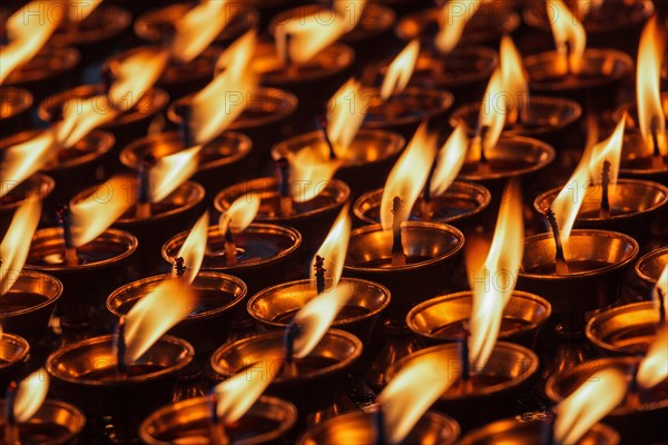 Burning candles in Buddhist temple